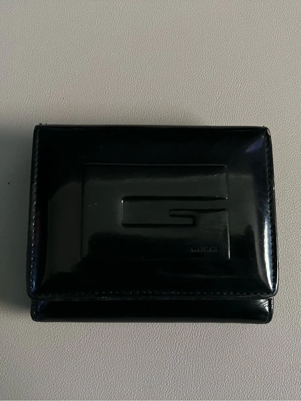 Gucci Black Patent Leather Bi-Fold Wallet with Embossed G